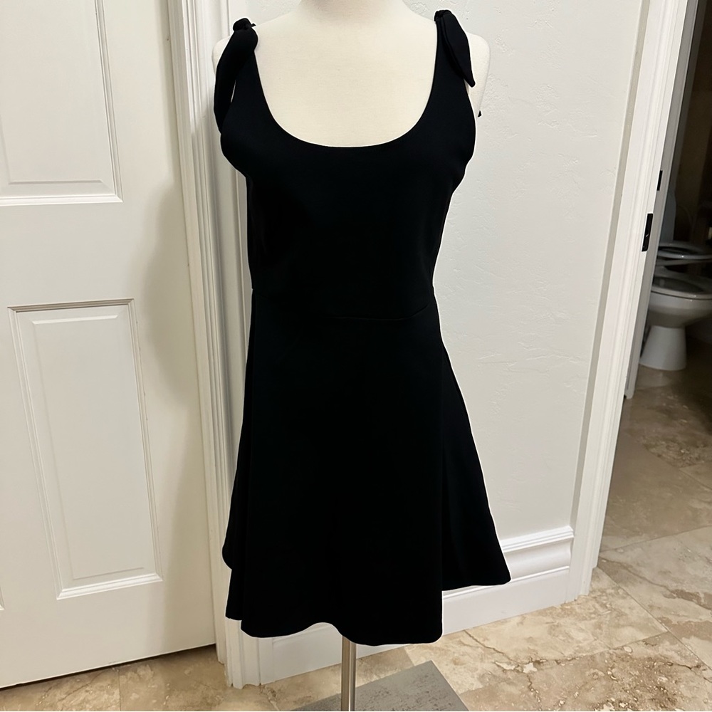 Fun short black knit flirty bow strap day dress.